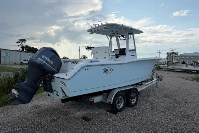 Slide: The Image of 2018 Sea Hunt Ultra 255 SE boat on trailer with Yamaha outboard motor. - 1