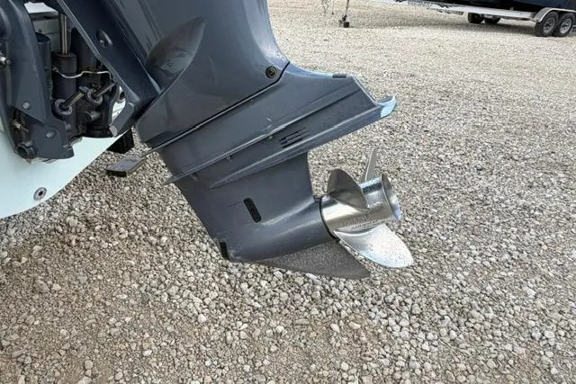 Slide: The Image of Outboard motor propeller of 2018 Sea Hunt Ultra 255 SE on gravel surface. - 22