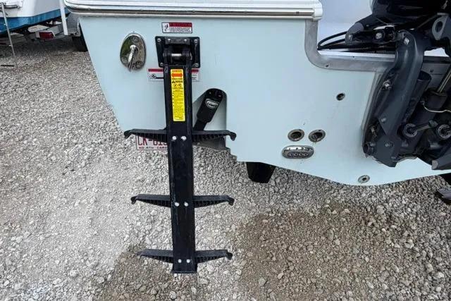Slide: The Image of Rear view of a 2018 Sea Hunt Ultra 255 SE boat with a mounted ladder. - 23