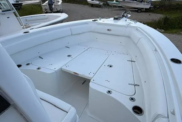 Slide: The Image of 2018 Sea Hunt Ultra 255 SE boat interior with spacious seating and storage compartments. - 5
