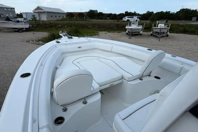 Slide: The Image of 2018 Sea Hunt Ultra 255 SE boat with spacious white seating and sleek design. - 6