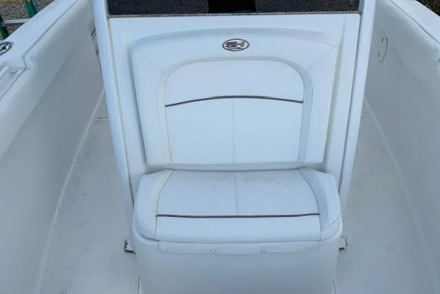 Slide: The Image of 2018 Sea Hunt Ultra 255 SE boat seat, white upholstery, sleek design. - 7