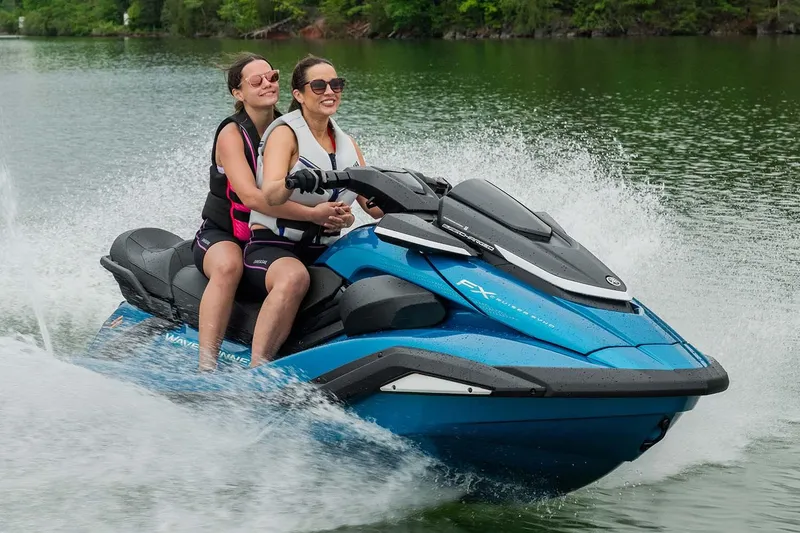 Slide: The Image of Manufacturer Provided Image: Two people riding a 2026 Yamaha WaveRunner FX Cruiser SVHO on a lake. - 1