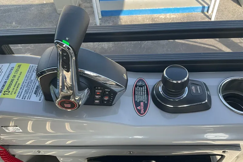 Slide: The Image of Control panel of 2025 Harris Solstice 250 SLEC boat with throttle and joystick. - 16