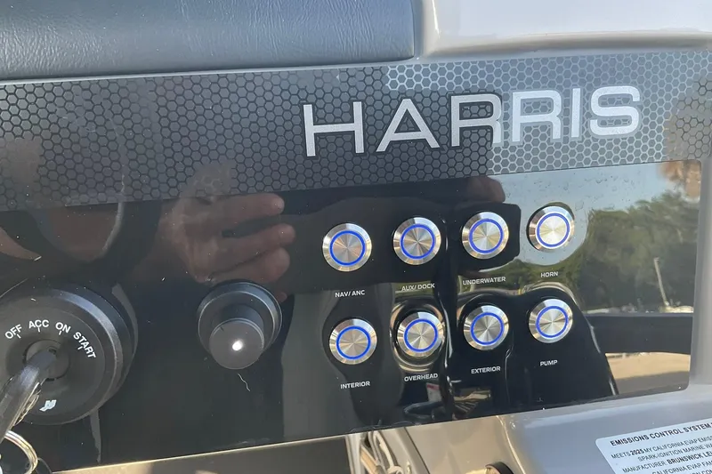 Slide: The Image of Control panel of 2025 Harris Solstice 250 SLEC boat with labeled buttons and switches. - 17