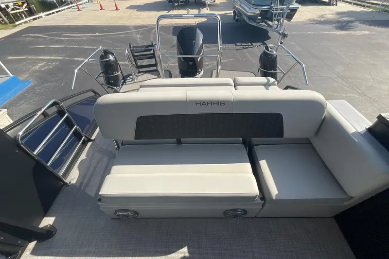Slide: The Image of 2025 Harris Solstice 250 SLEC boat interior with plush seating and modern design. - 19