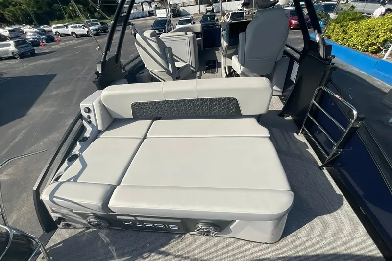 Slide: The Image of 2025 Harris Solstice 250 SLEC boat interior with spacious seating and modern design. - 20