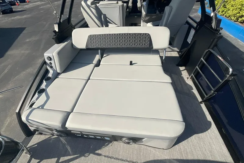 Slide: The Image of 2025 Harris Solstice 250 SLEC boat interior with luxurious seating and cup holders. - 21