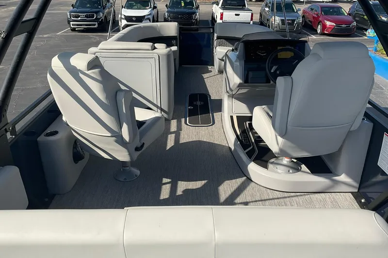 Slide: The Image of Interior of 2025 Harris Solstice 250 SLEC boat with modern seating and steering console. - 23