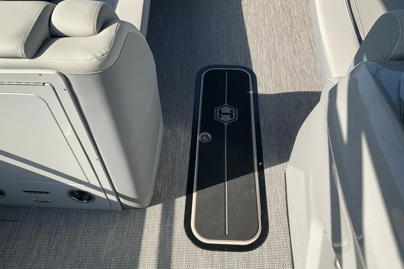 Slide: The Image of Interior of 2025 Harris Solstice 250 SLEC boat with sleek seating and flooring. - 24