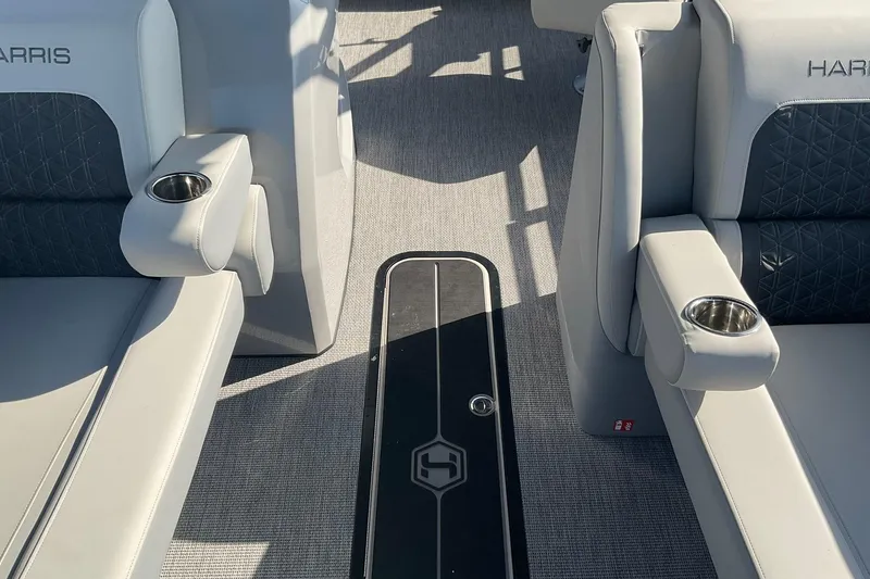Slide: The Image of Interior of 2025 Harris Solstice 250 SLEC boat with luxurious seating and cup holders. - 26