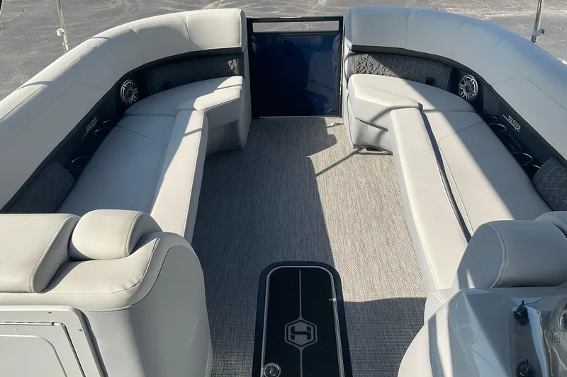 Slide: The Image of Luxurious interior of 2025 Harris Solstice 250 SLEC pontoon boat with plush seating. - 27