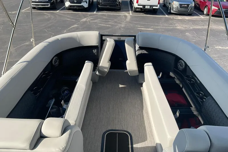 Slide: The Image of 2025 Harris Solstice 250 SLEC pontoon boat interior with spacious seating and cup holders. - 28