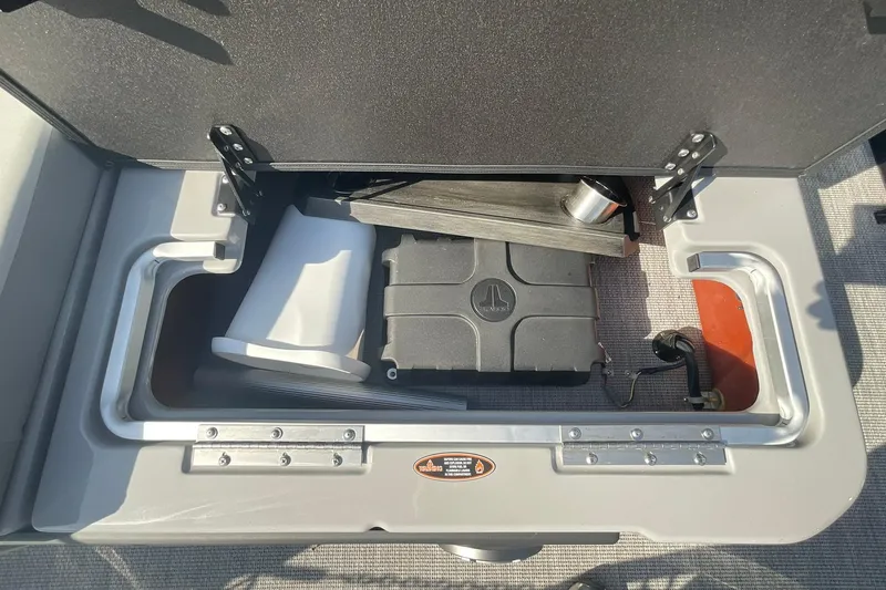Slide: The Image of Storage compartment of 2025 Harris Solstice 250 SLEC boat, featuring organized interior space. - 31
