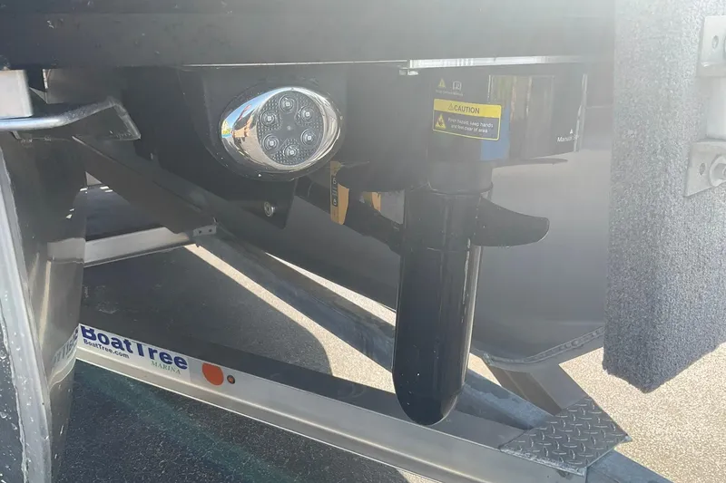 Slide: The Image of Close-up of 2025 Harris Solstice 250 SLEC boat trailer with caution label and lighting. - 35