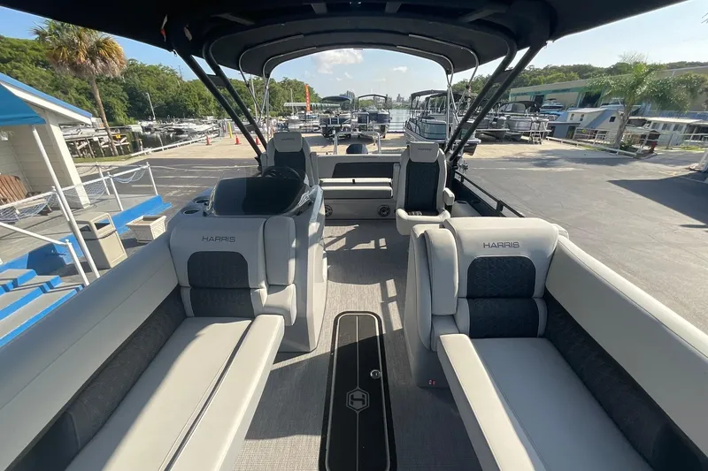Slide: The Image of 2025 Harris Solstice 250 SLEC pontoon boat interior with luxurious seating and modern design. - 38