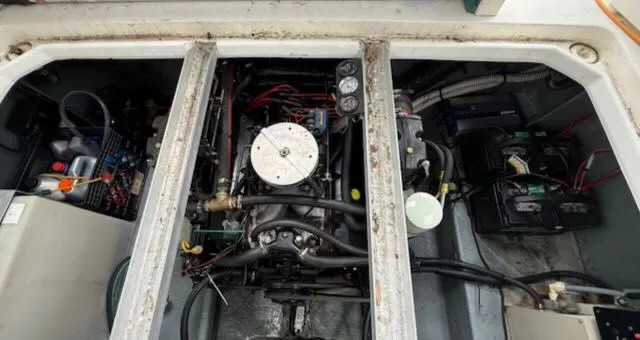 Slide: The Image of Engine compartment of a 1994 Sea Ray 270 with visible engine and wiring. - 10