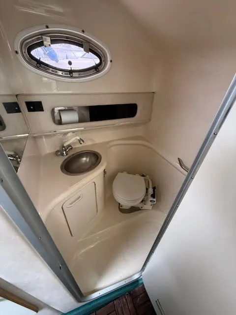 Slide: The Image of Interior view of a boat bathroom with sink and toilet. - 21