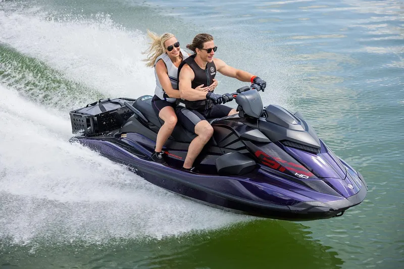 Slide: The Image of Manufacturer Provided Image: 2026 Yamaha WaveRunner GP HO jet ski with two riders speeding on water. - 1