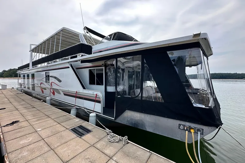 The Image of Houseboat docked on a lake, Fantasy 18x82 model, 2001, with covered upper deck. - 0