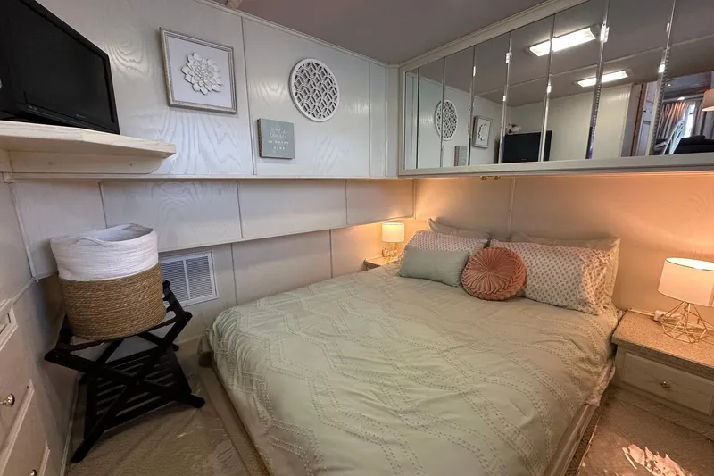 Slide: The Image of Cozy bedroom in a 2001 Fantasy 18x82 houseboat with elegant decor and soft lighting. - 10