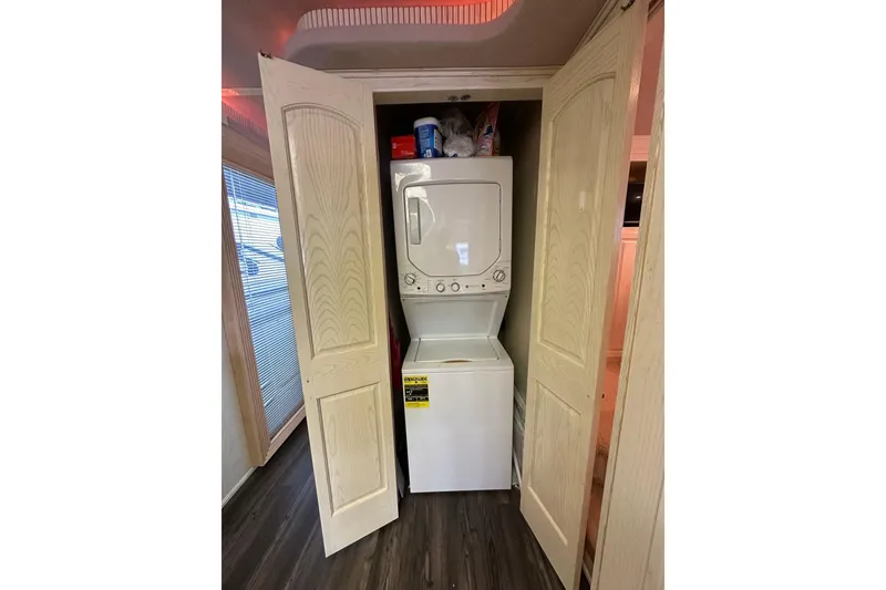 Slide: The Image of Stacked washer and dryer in a closet, Fantasy 18x82 model, 2001. - 13