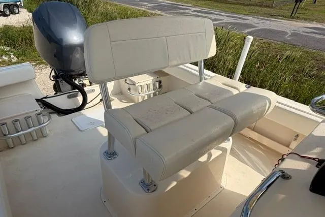 Slide: The Image of 2007 Parker 23 SE boat interior with cushioned seating and outboard motor. - 11