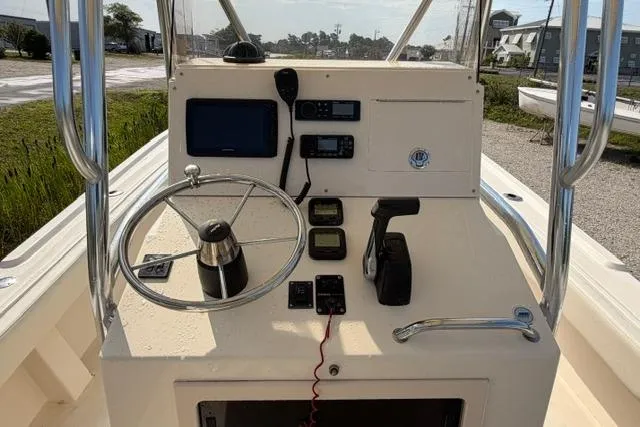 Slide: The Image of 2007 Parker 23 SE boat dashboard with steering wheel and navigation controls. - 12