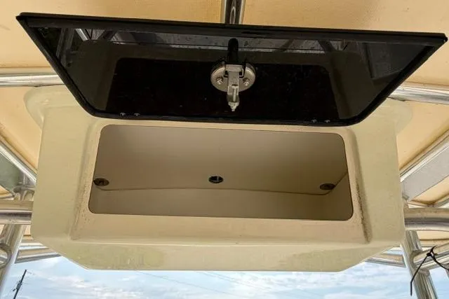 Slide: The Image of Open storage compartment on a 2007 Parker 23 SE boat. - 16
