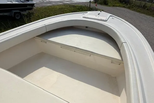 Slide: The Image of 2007 Parker 23 SE boat interior, showcasing spacious seating and storage area. - 17