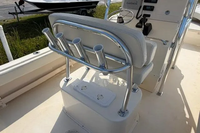Slide: The Image of 2007 Parker 23 SE boat interior with rod holders and control panel. - 9