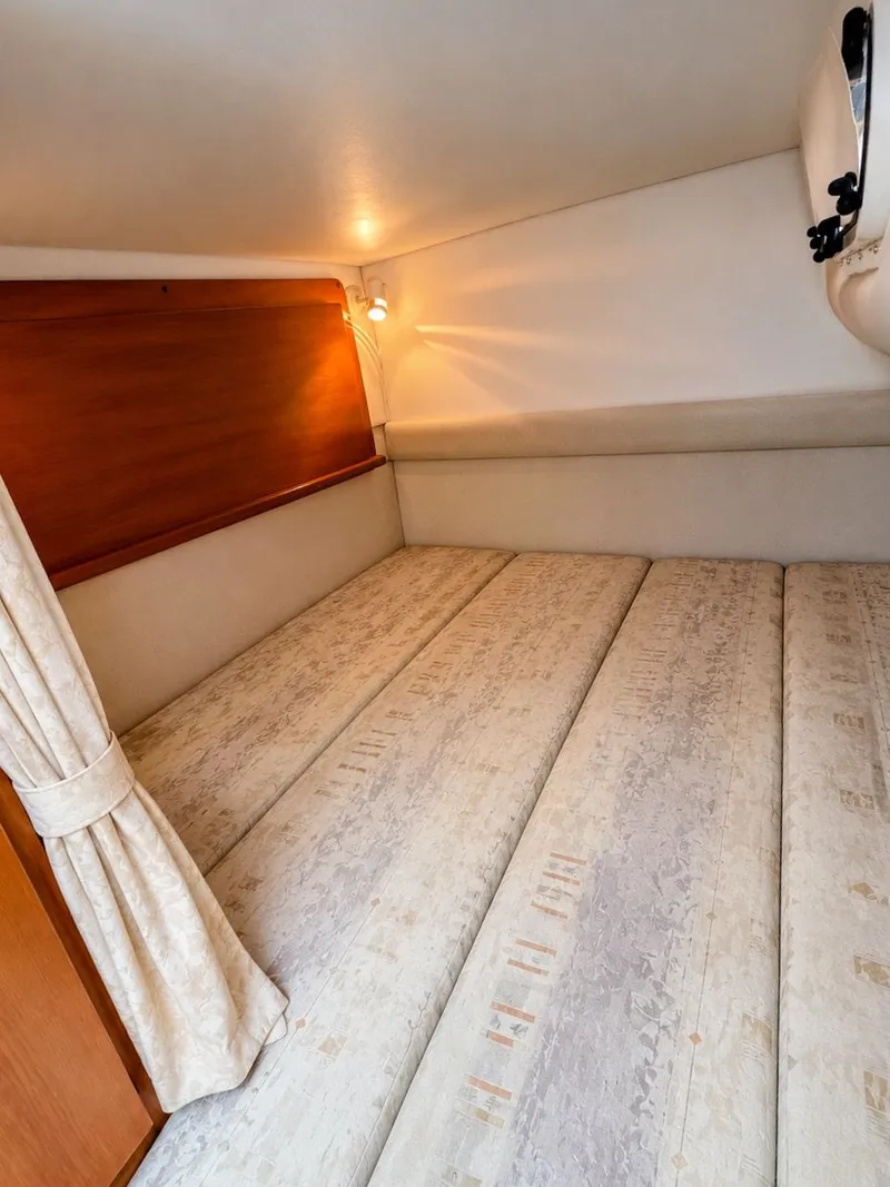 Slide: The Image of Interior of the 2001 Four Winns 298 Vista with a cozy sleeping area. - 24