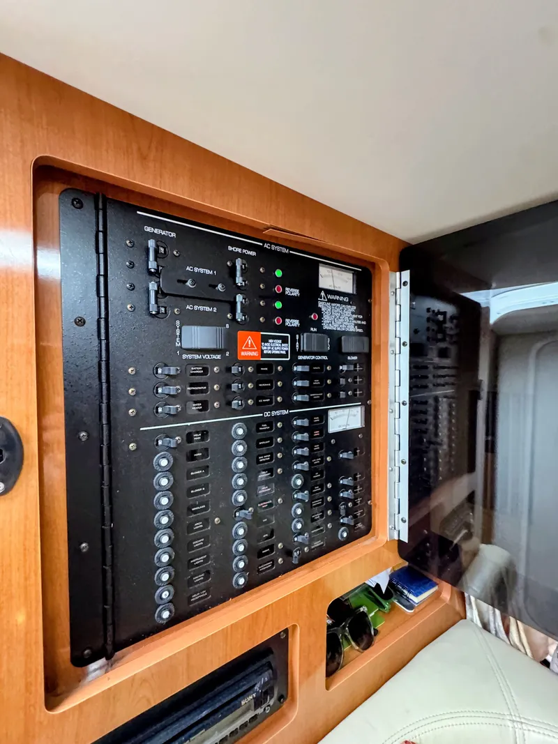 Slide: The Image of Electrical control panel inside the 2001 Four Winns 298 Vista. - 26