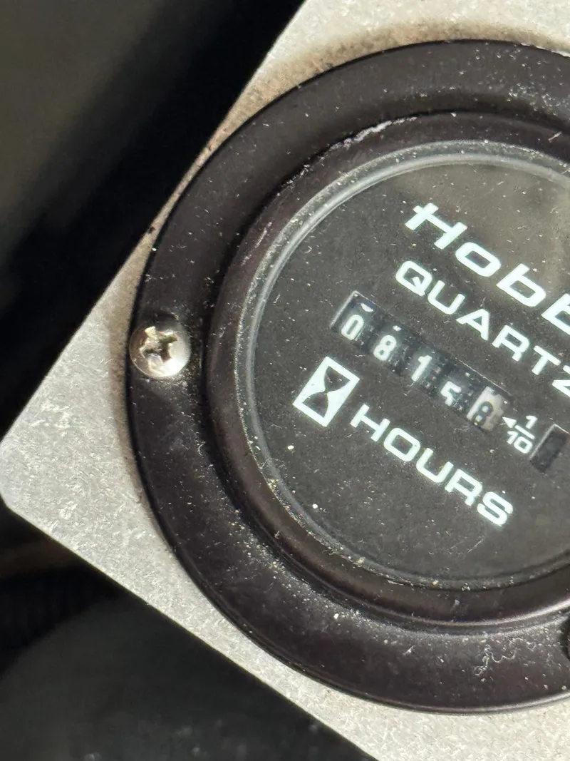 Slide: The Image of Close-up of an hour meter labeled "Hobbs Quartz" showing 816.1 hours. - 34