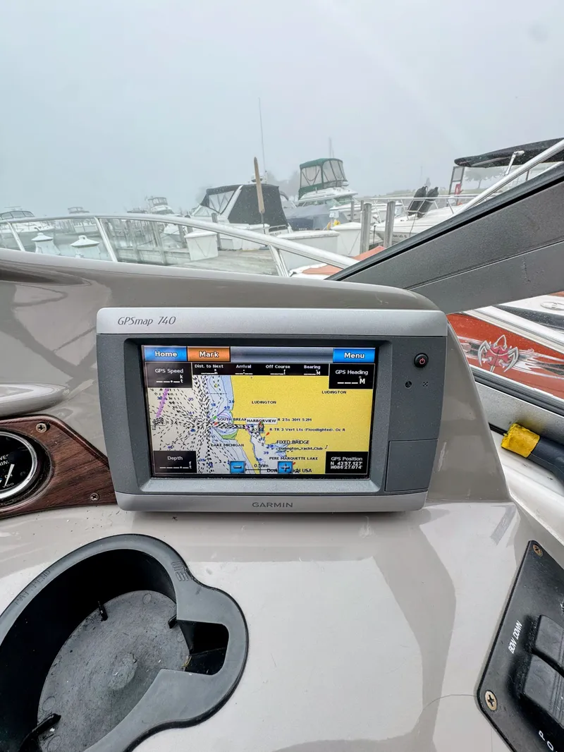 Slide: The Image of A GPS navigation system on a boat with other boats in the background. - 9