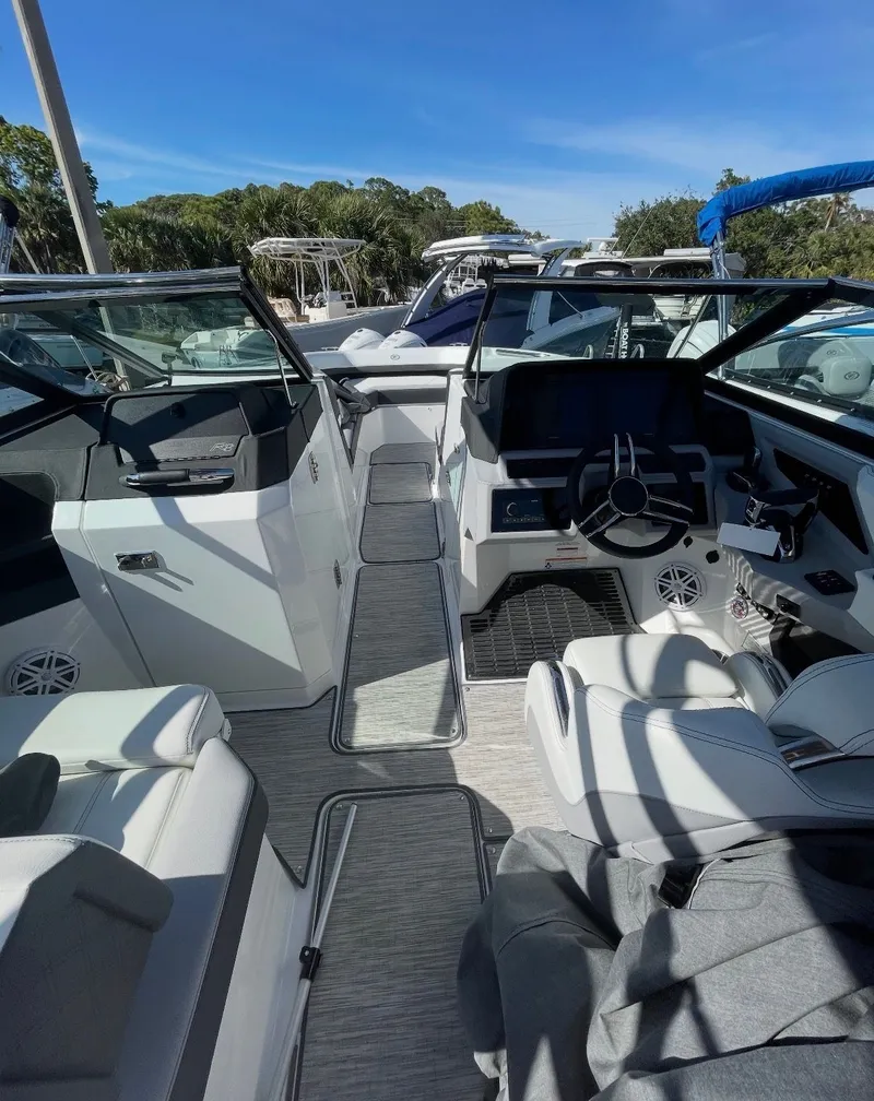 Slide: The Image of Interior view of a modern boat with white seating and a black dashboard. - 3