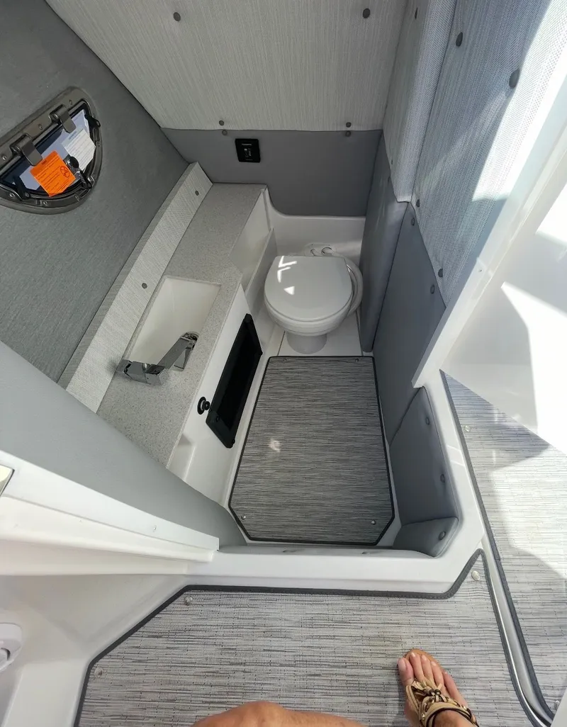 Slide: The Image of Interior of a modern boat cabin with a toilet and sink. - 5