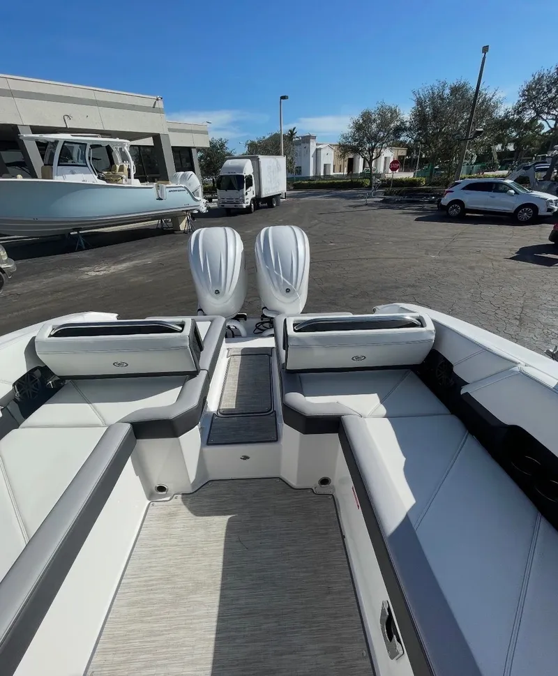 Slide: The Image of The image shows the cockpit of a 2023 Cobalt R8 boat with white seating. - 7