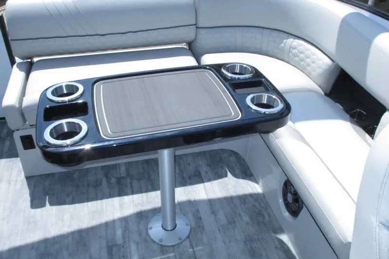Slide: The Image of Luxurious seating area with table on 2021 Crest Caribbean LX 250 SLS boat. - 10