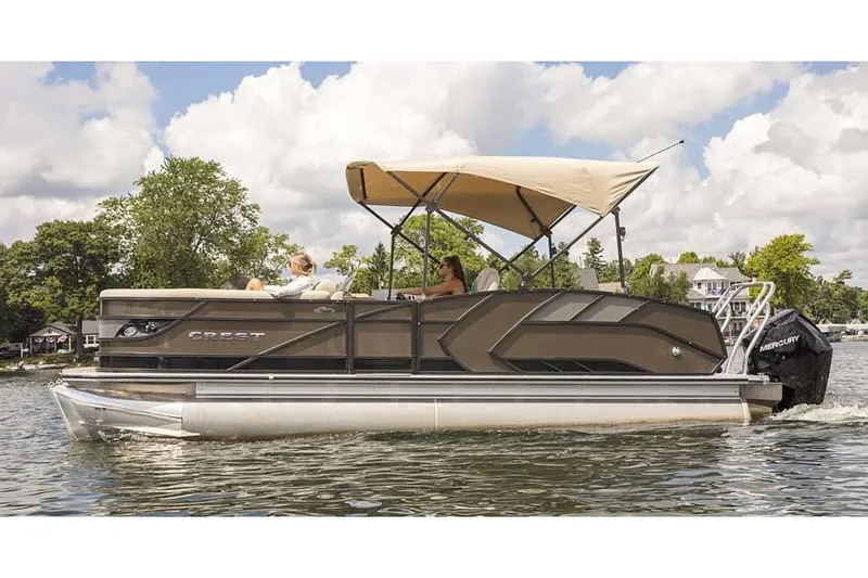 Slide: The Image of Manufacturer Provided Image: 2021 Crest Caribbean LX 250 SLS pontoon boat cruising on a lake. - 5