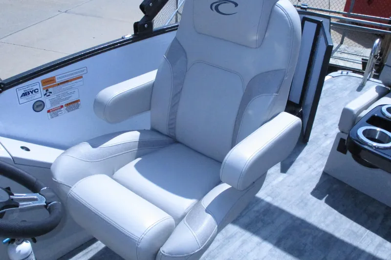 Slide: The Image of Captain's chair in 2021 Crest Caribbean LX 250 SLS boat, featuring sleek design and comfortable seating. - 8
