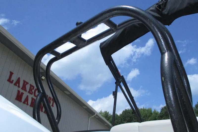 Slide: The Image of 2021 Crest Caribbean LX 250 SLS boat detail against blue sky at Lakecrest Marina. - 18