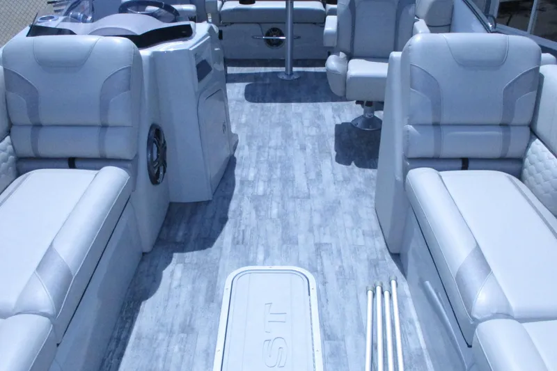 Slide: The Image of 2021 Crest Caribbean LX 250 SLS boat interior with luxurious seating and modern design. - 9