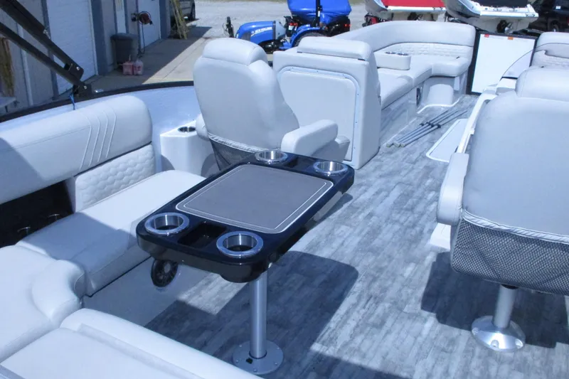 Slide: The Image of Luxurious interior of 2021 Crest Caribbean LX 250 SLS pontoon boat with seating and table. - 14