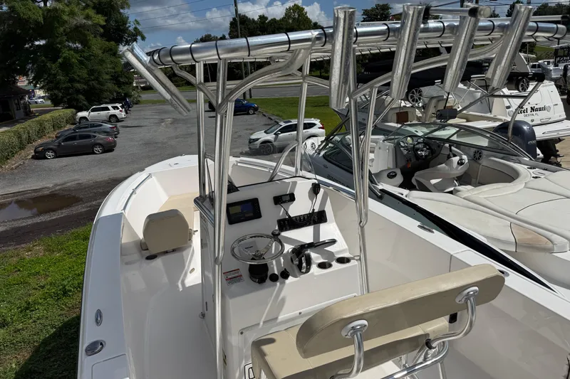 Slide: The Image of 2023 Aquasport 2200 Center Console boat with sleek design and modern controls. - 5