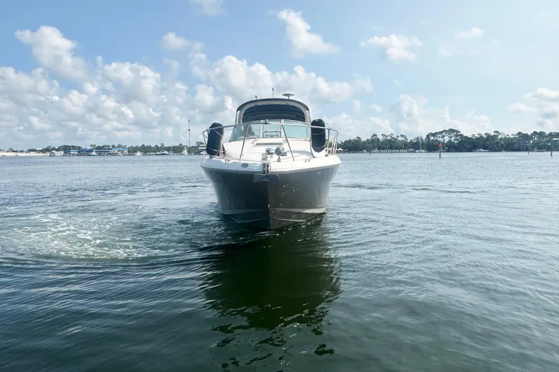 Slide: The Image of 2006 Sea Ray 300 Sundancer cruising on a calm, sunny day. - 3