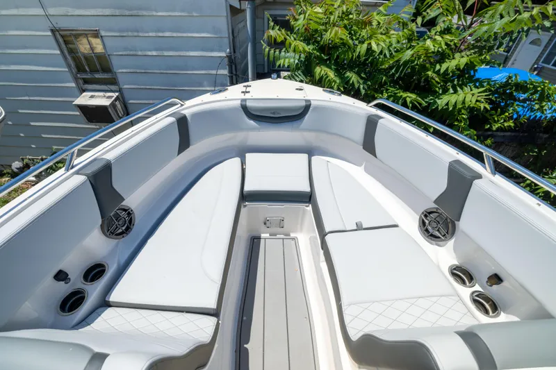 Slide: The Image of 2025 Chaparral 250 OSX boat interior with spacious seating and modern design. - 13