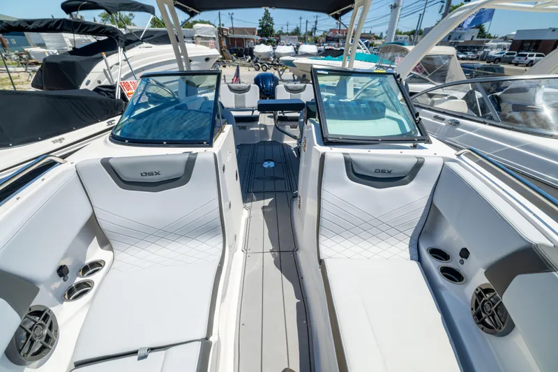 Slide: The Image of 2025 Chaparral 250 OSX boat interior with sleek seating and modern design. - 14