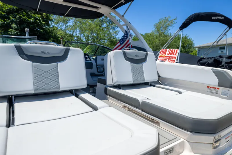 Slide: The Image of 2025 Chaparral 250 OSX boat interior with "For Sale" sign, featuring luxurious seating. - 16