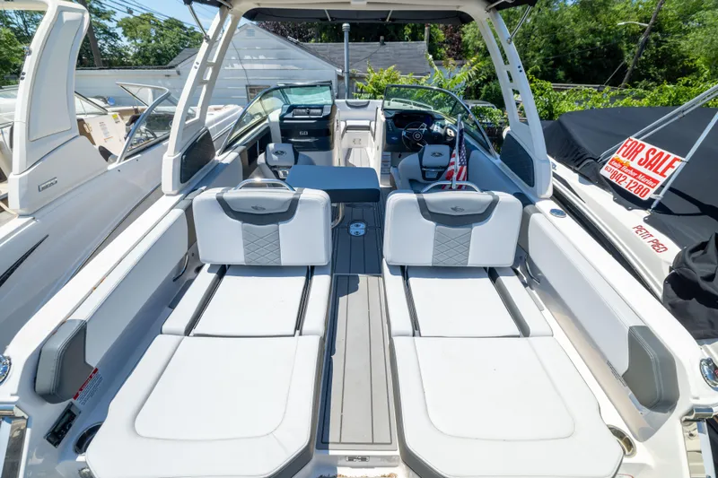 Slide: The Image of 2025 Chaparral 250 OSX boat interior with luxurious seating and modern design. - 17
